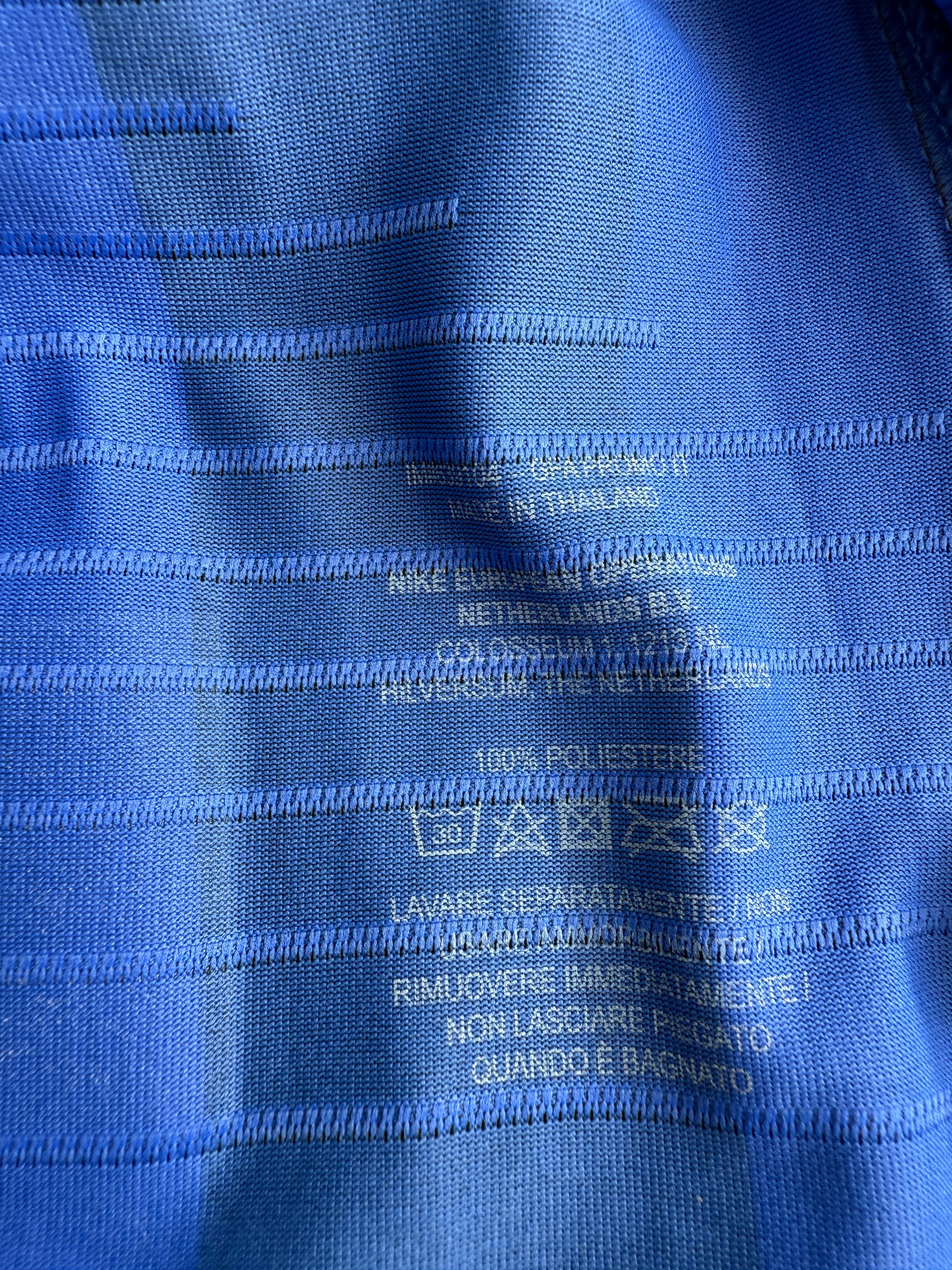 Close-up of blue fabric with text and labels