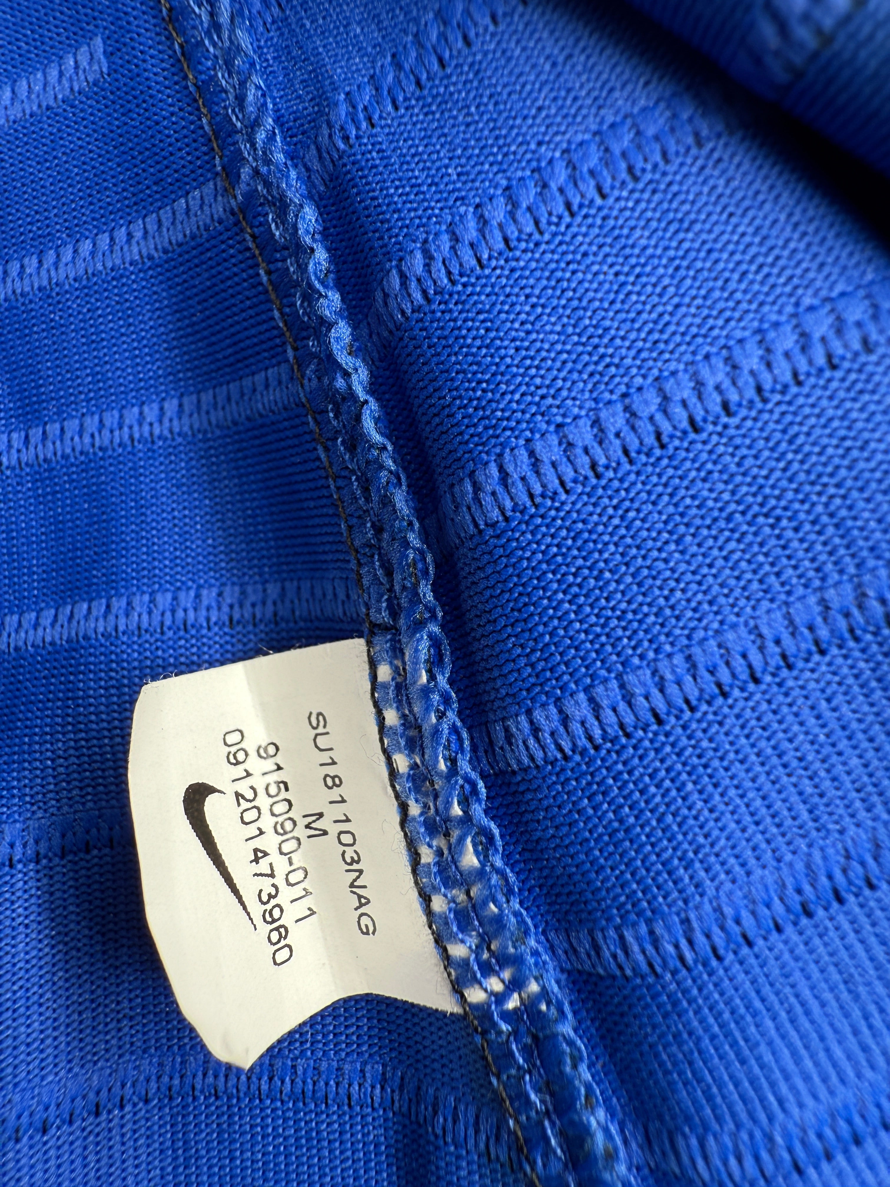 Close-up of a blue textured fabric with a label