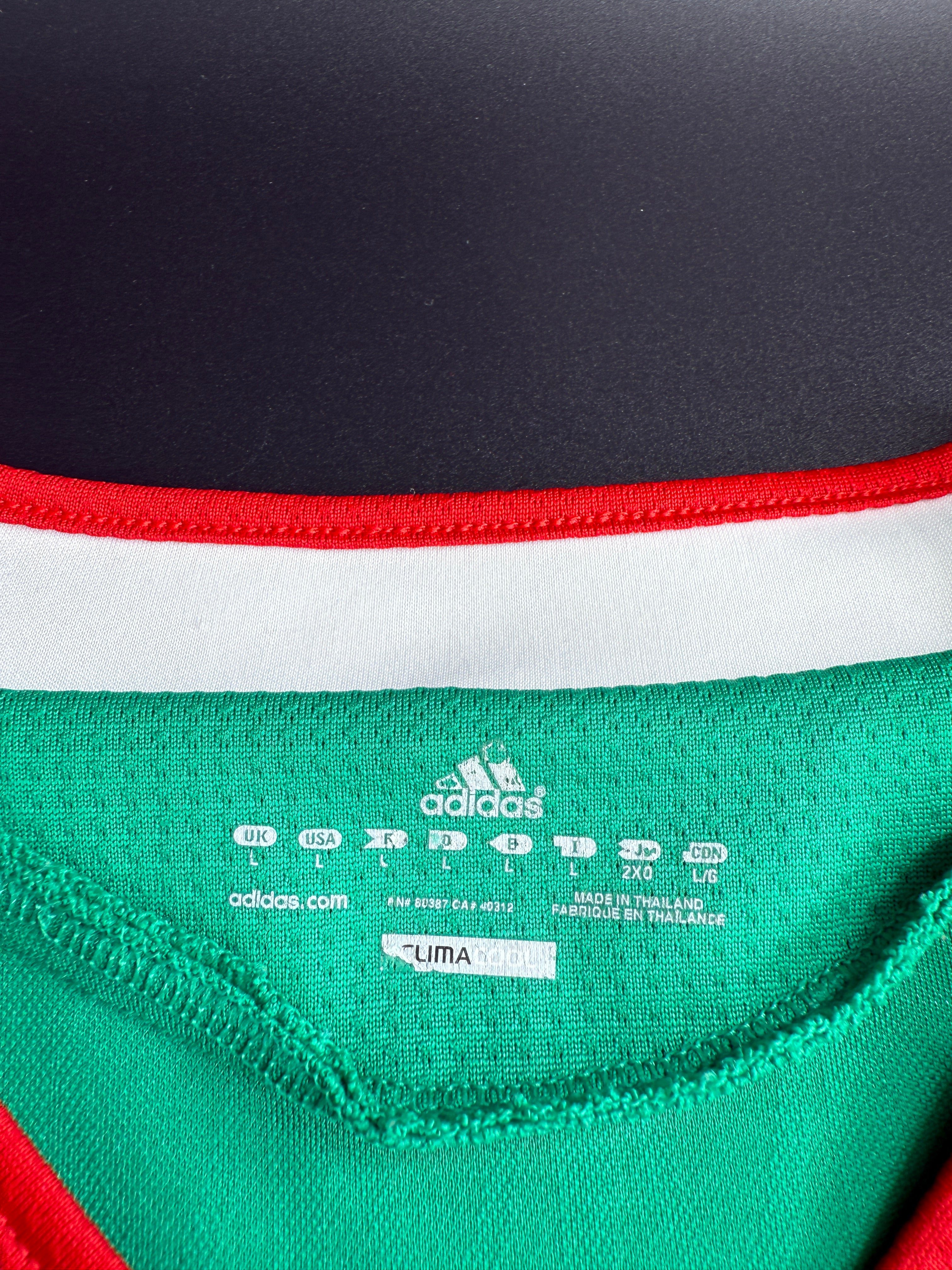 Close-up of a label on a green and black sports jacket.