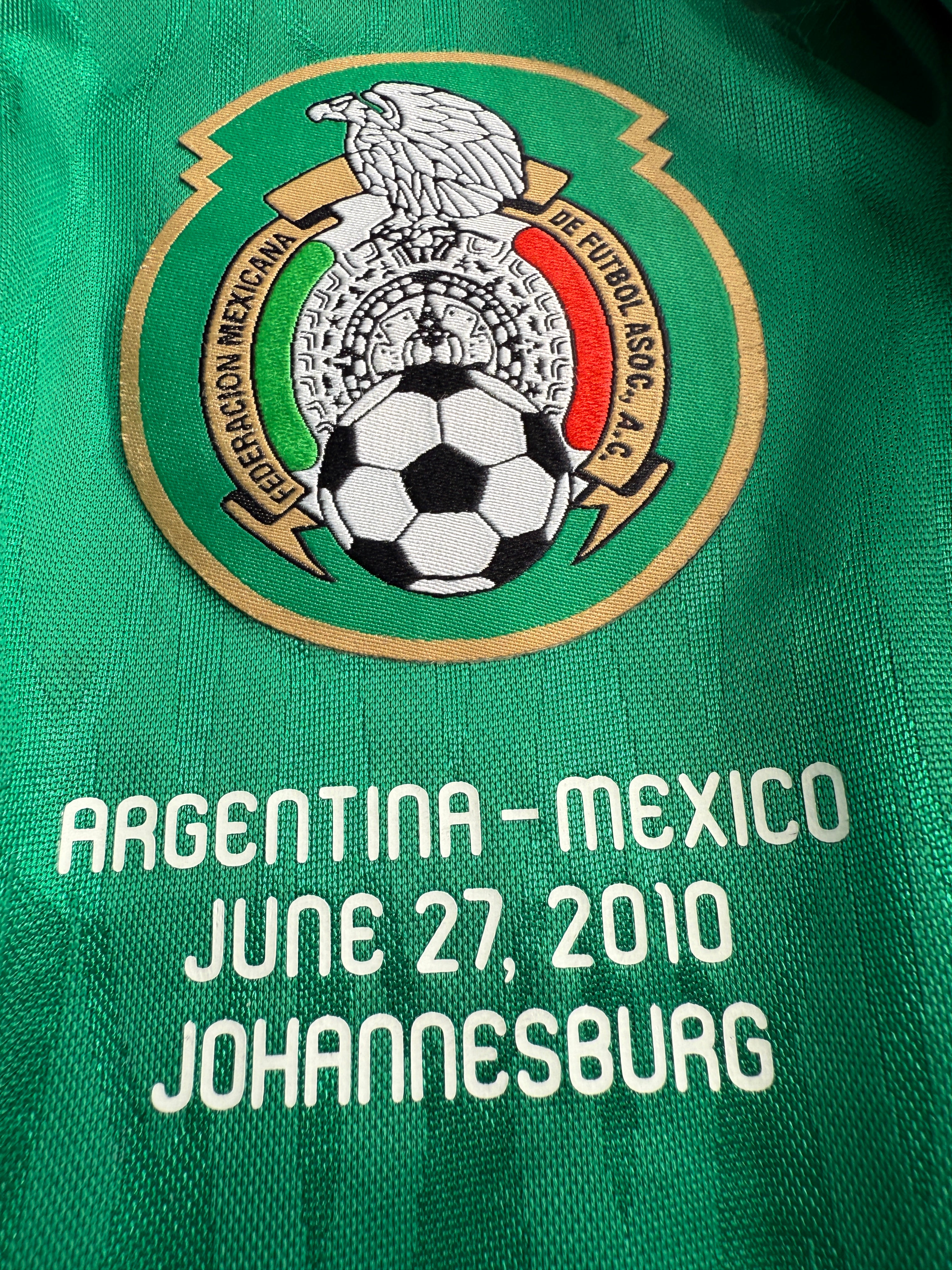 Green fabric with soccer logo and text
