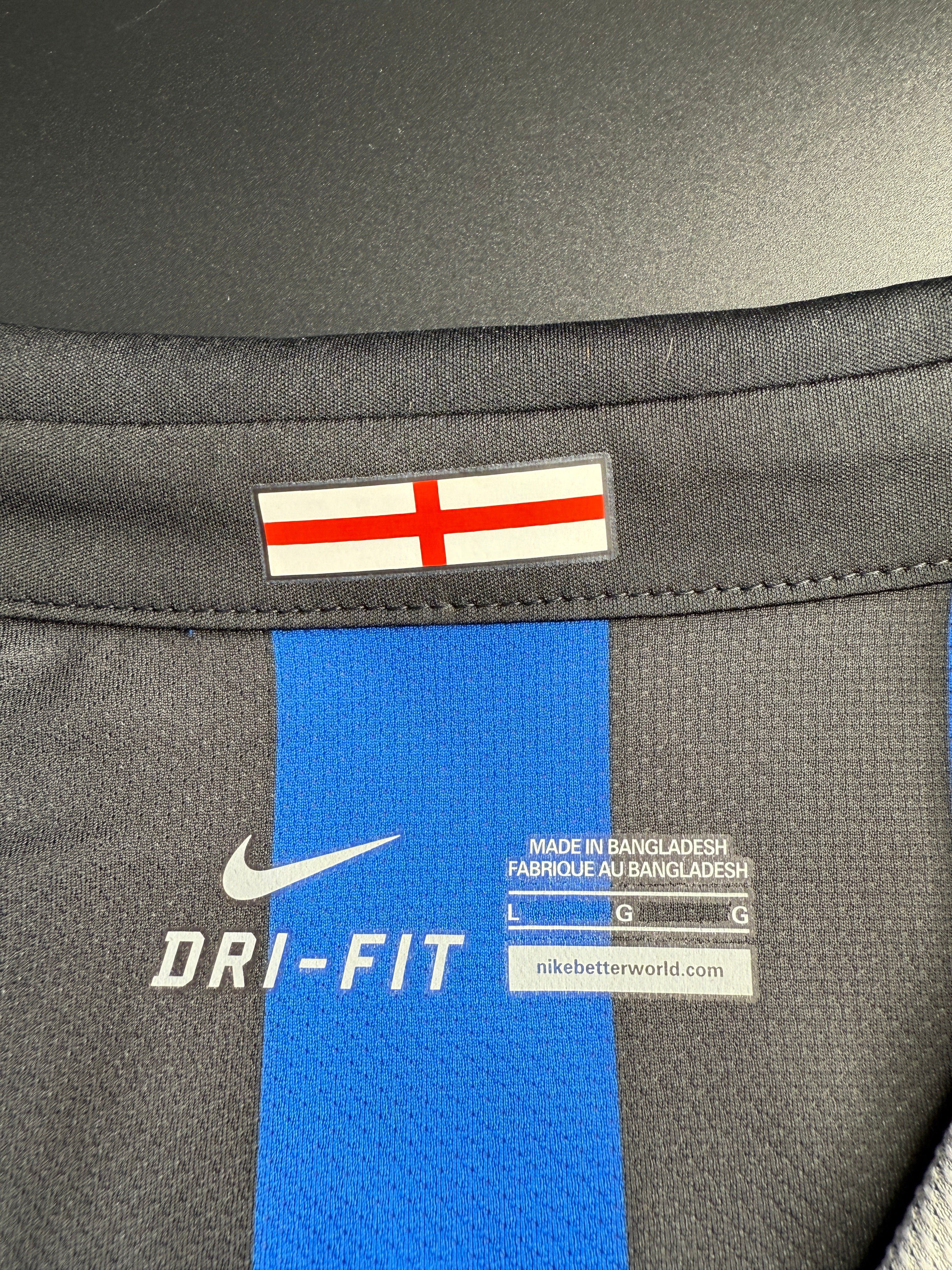 Close-up of a sports jacket with label and logo details.