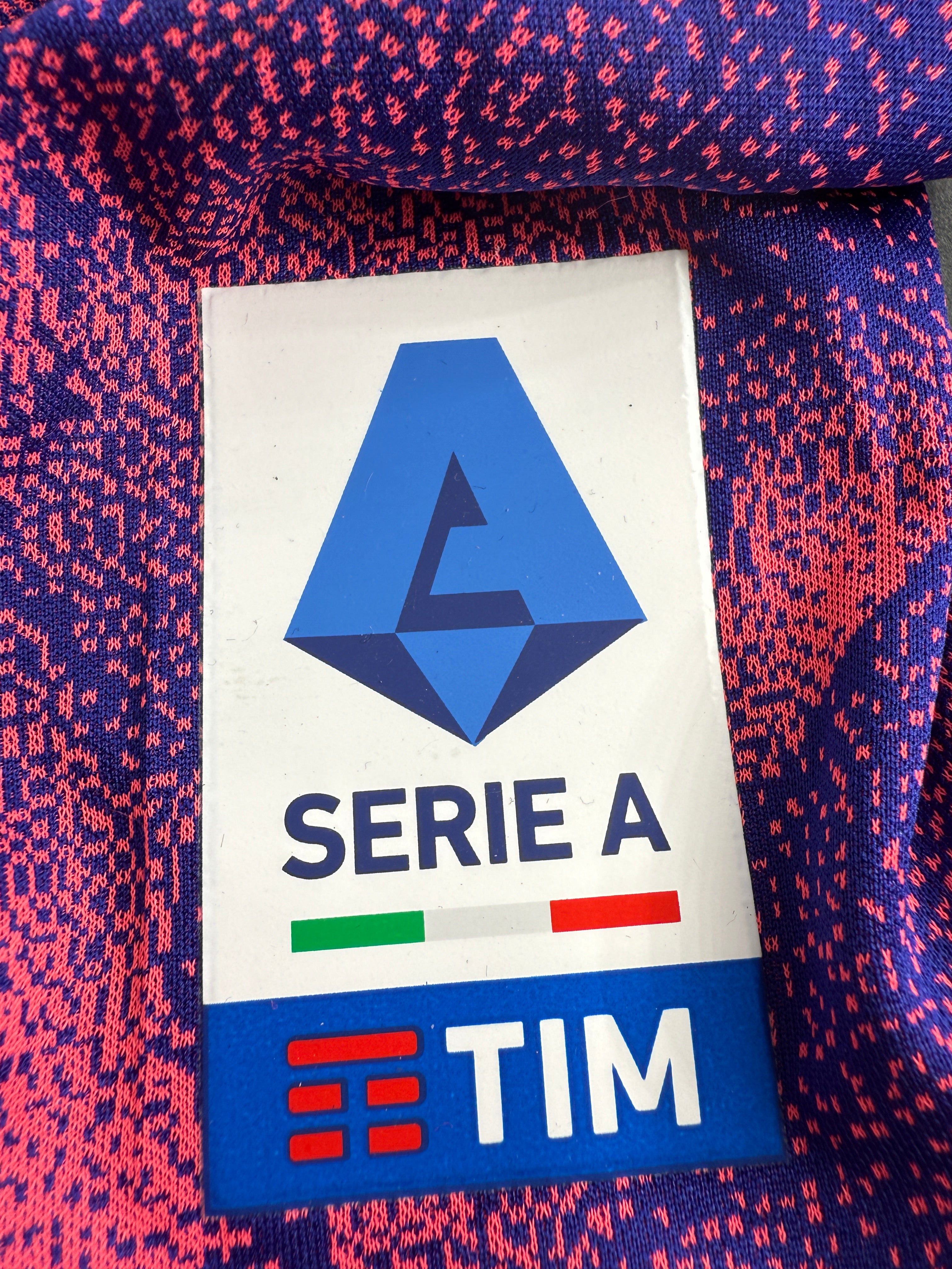 Logo of Serie A and TIM on a sports jersey.