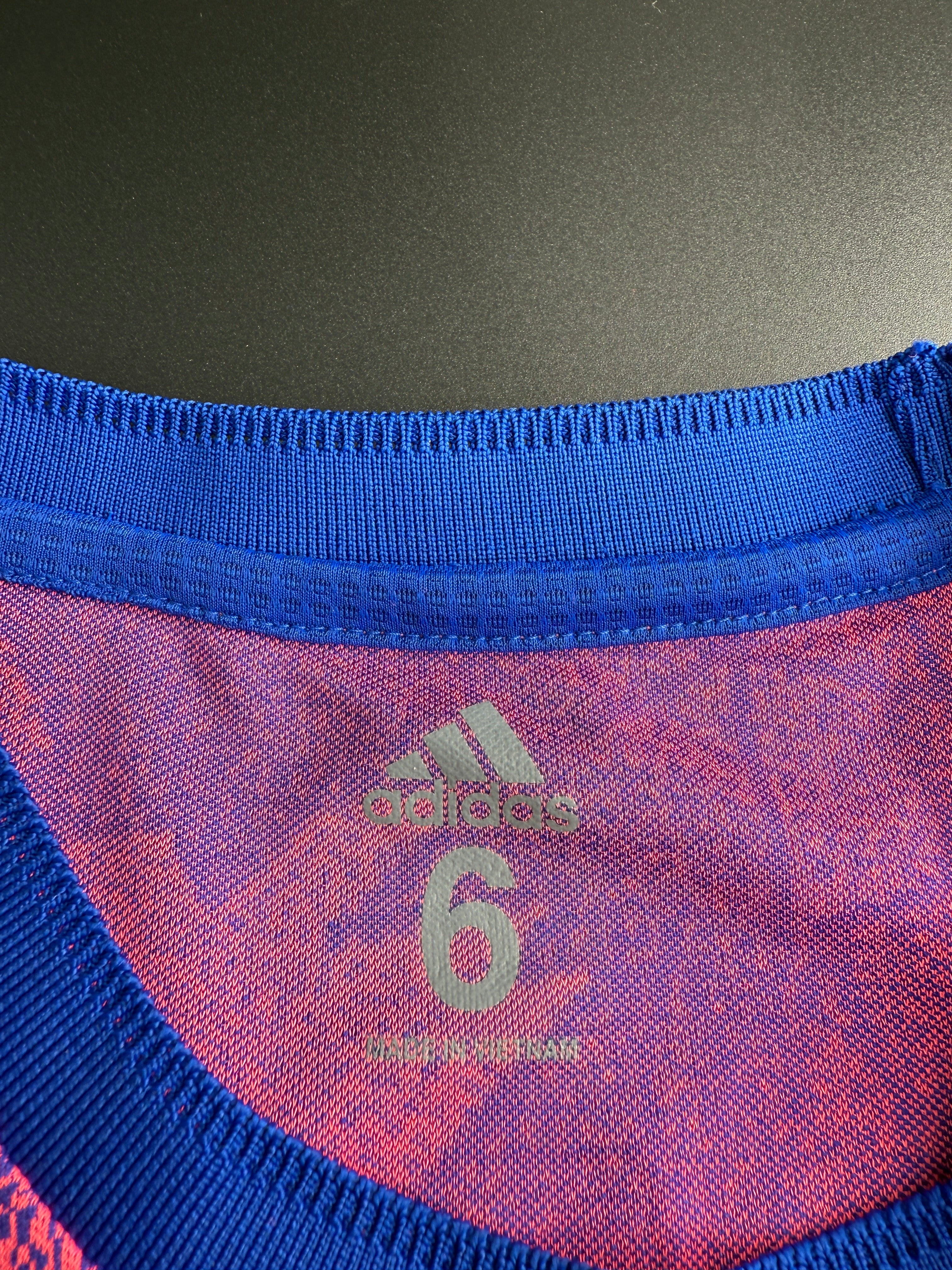Close-up of a textured fabric with a logo on a sports bag.