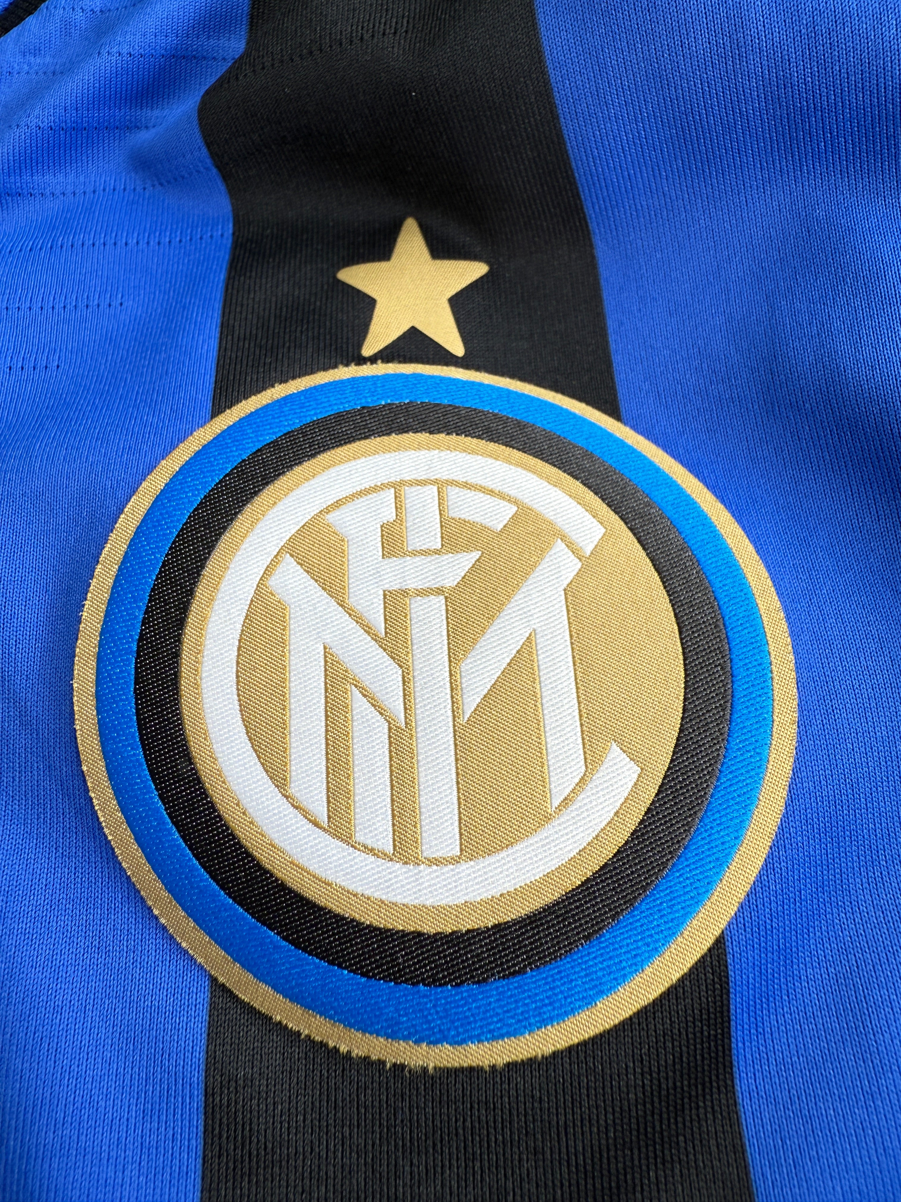 Close-up of a sports team logo on a uniform.